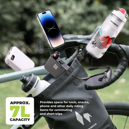 ROCKBROS front fork rack bags with items visible, black roll-top bags on a bicycle
