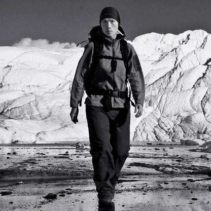 Thermal skull cap liner worn under a hood in cold outdoor conditions