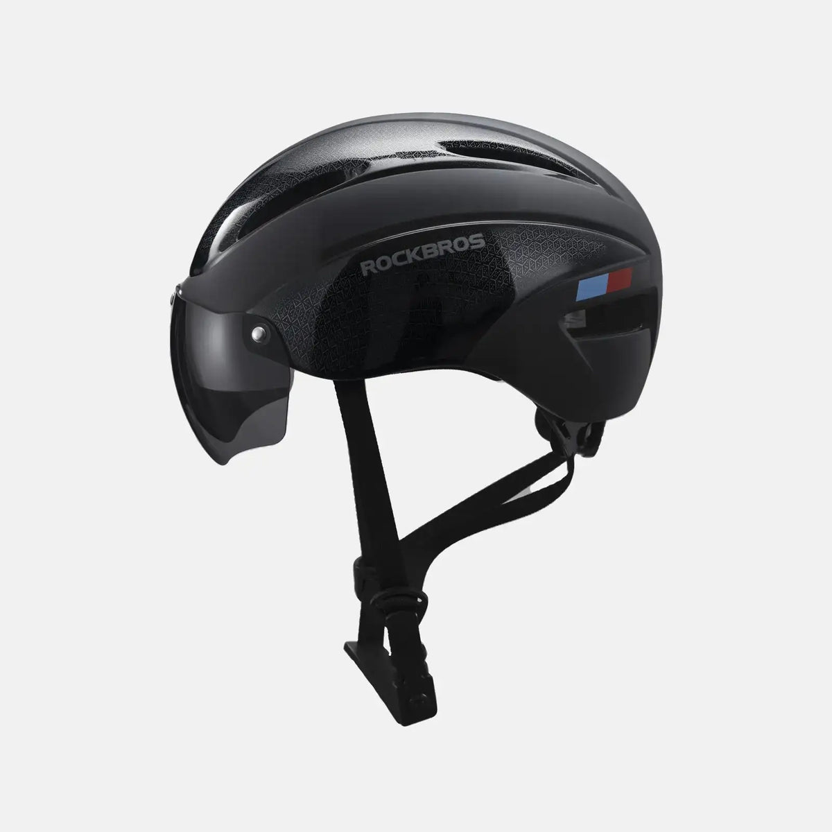 Black bike helmet with vented shell and adjustable chin strap