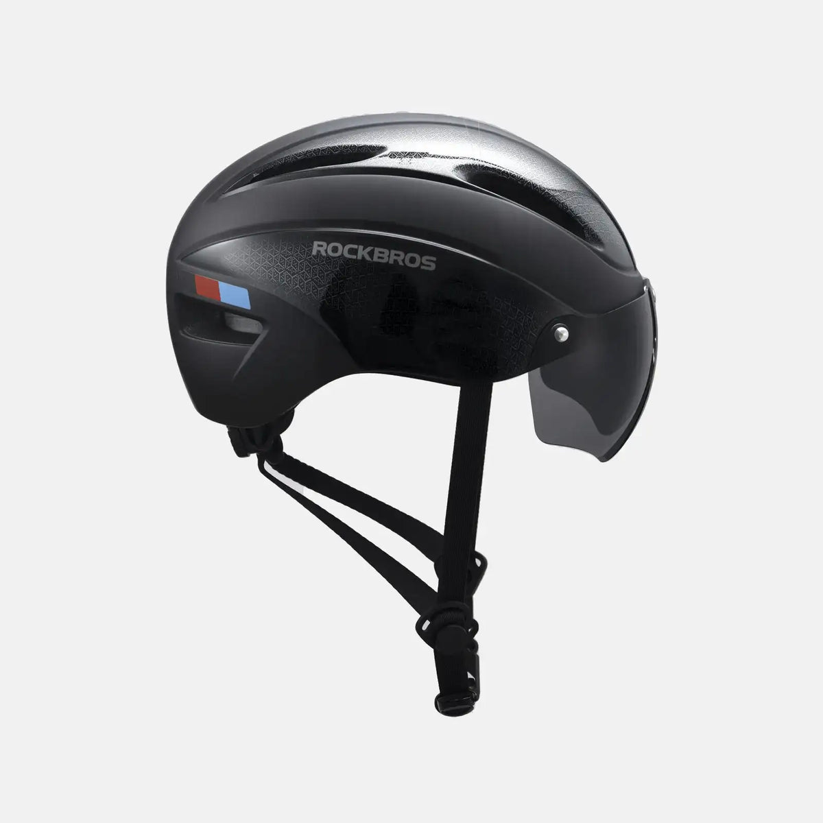 Black bike helmet with side vents, side protectors, and chin strap