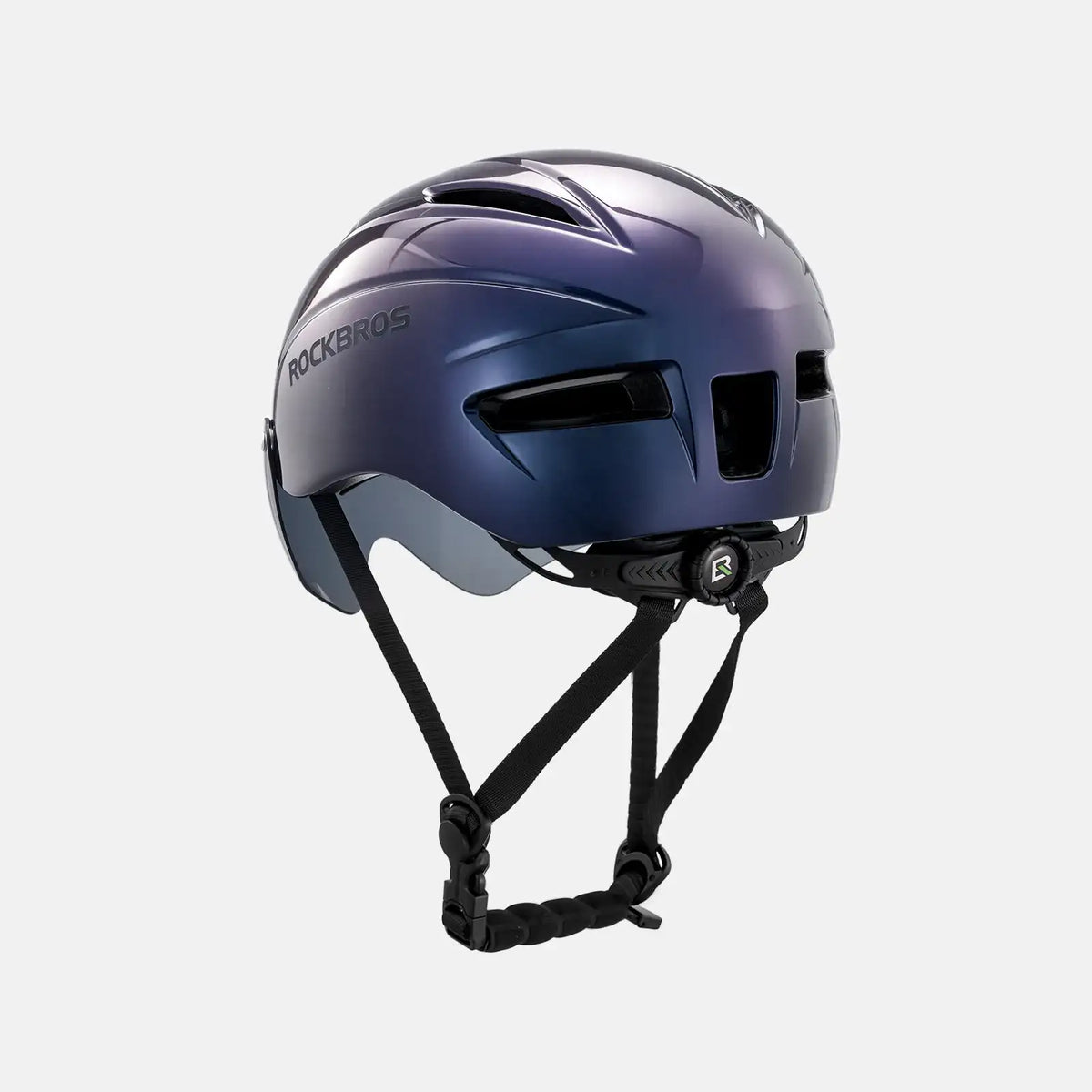 Purple-blue bike helmet with integrated visor and front vents, chin strap