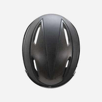 Bike helmet with glossy gray top shell, close-up top view with vent openings