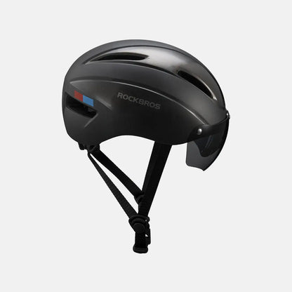 Bike helmet with matte black shell and chin strap, side view with color accent strip