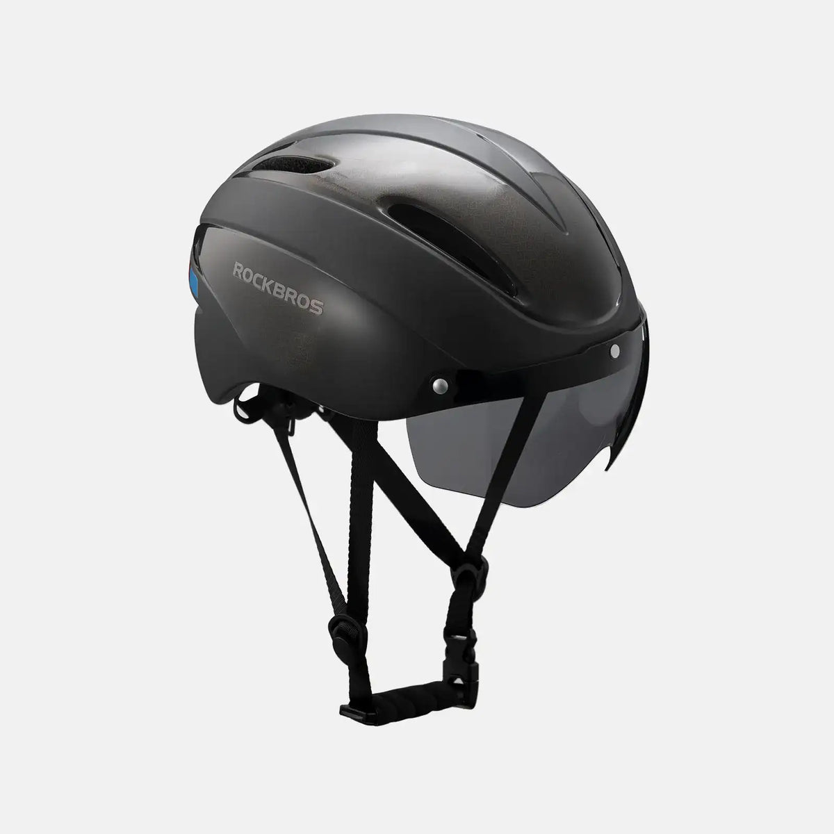 Bike helmet with glossy black shell and chin strap, rear three-quarter view