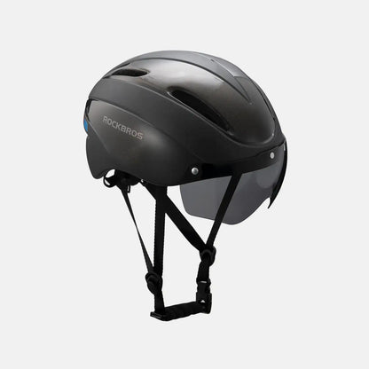 Bike helmet with glossy black shell and chin strap, rear three-quarter view
