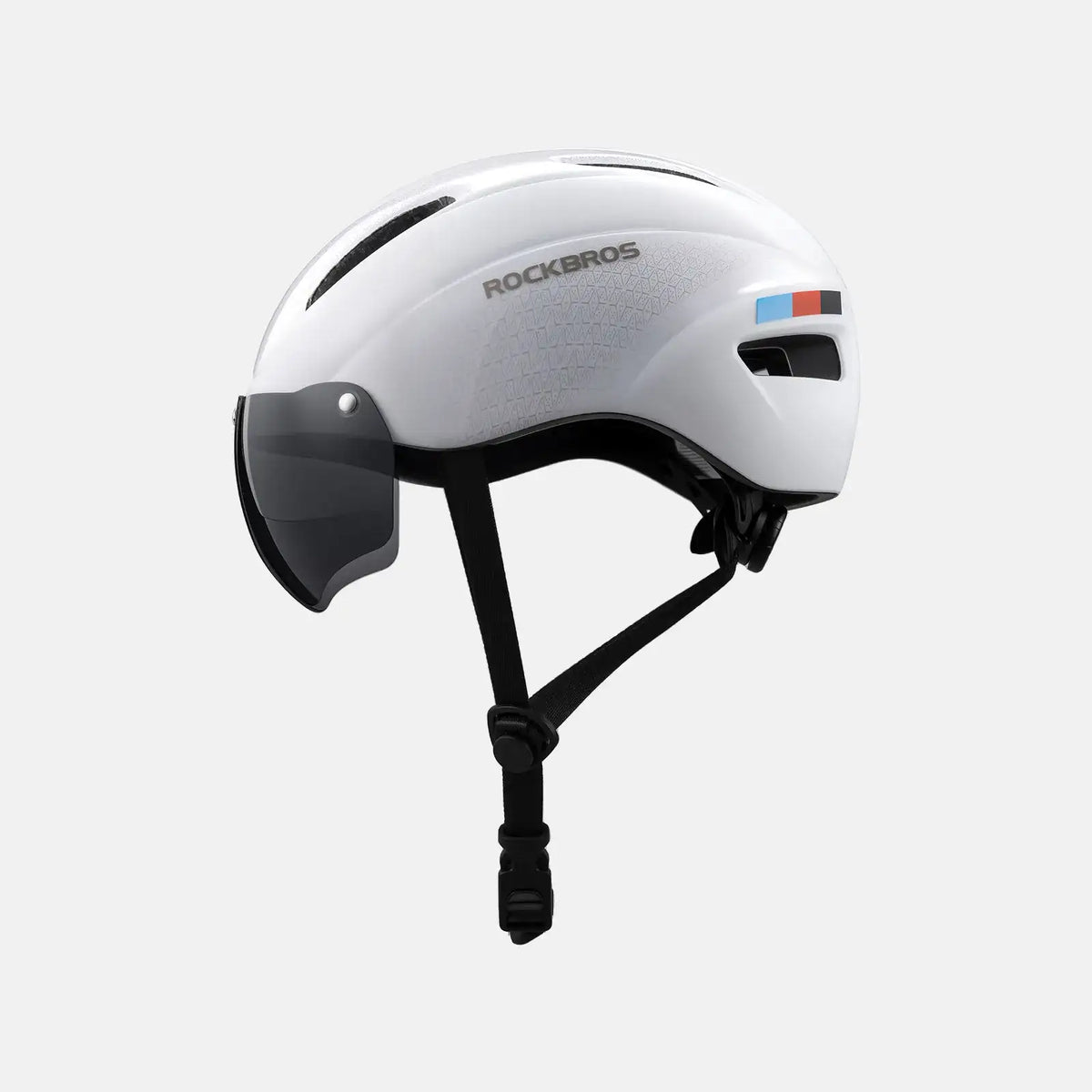 White cycling helmet with black chin strap and magnetic face shield visor.