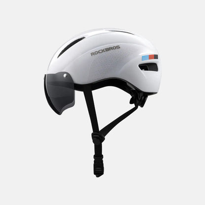 White cycling helmet with black chin strap and magnetic face shield visor.