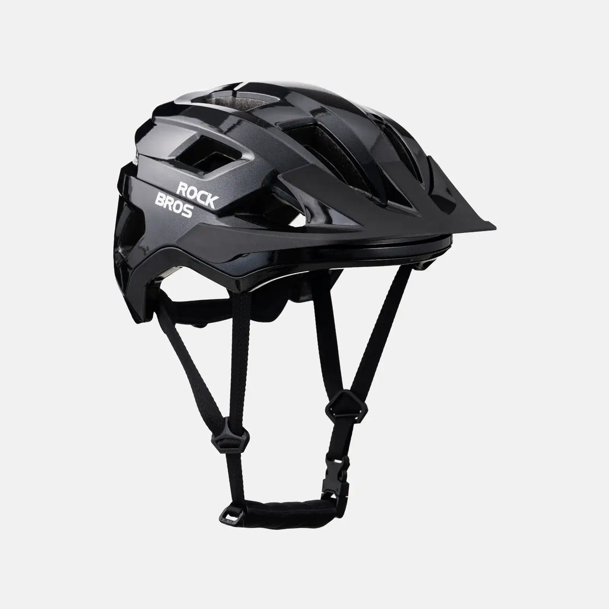 Black youth bike helmet in three-quarter view with chin strap and vents