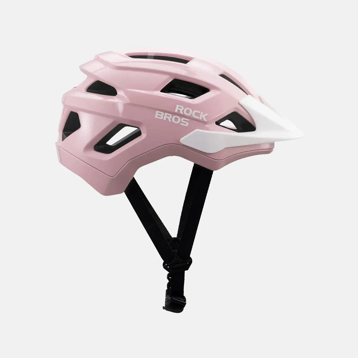 Pink youth bike helmet three-quarter view with vent openings and strap