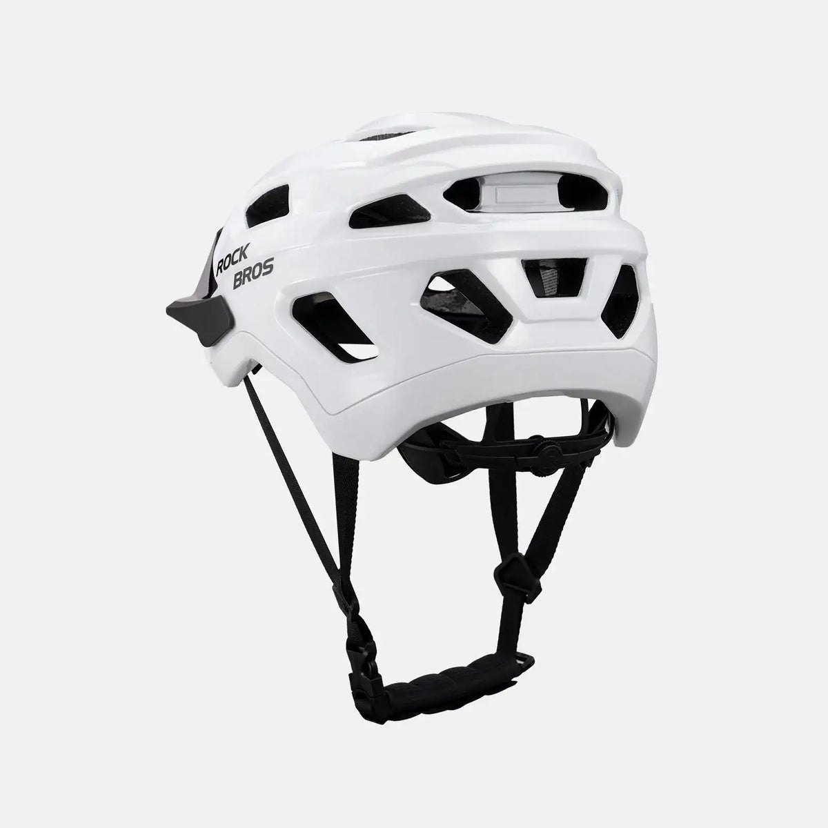 White and black youth bike helmet, angled side view with adjustable straps