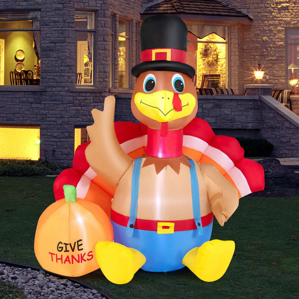 Inflatable turkey in top hat with light-up pumpkin reading 'GIVE THANKS'