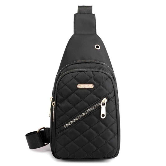 Black quilted nylon sling bag with adjustable strap, front zipper and zip pocket.