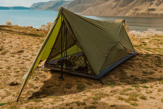 Olive green single-person tent angled view with open entrance and mesh wall