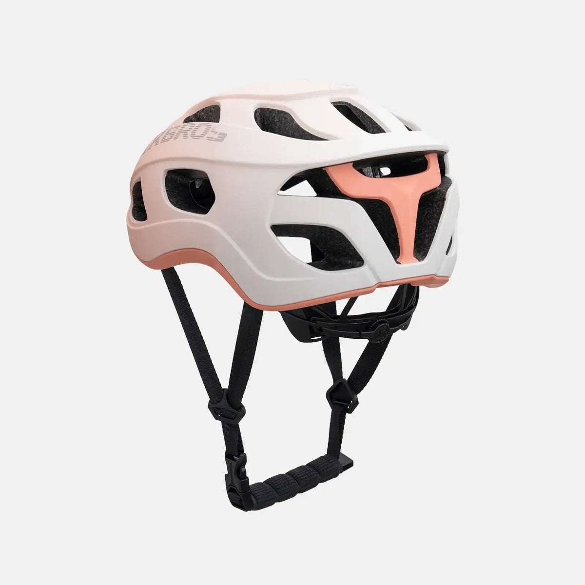 Lightweight bike helmet in matte pink, front three-quarter view with vent cutouts and straps