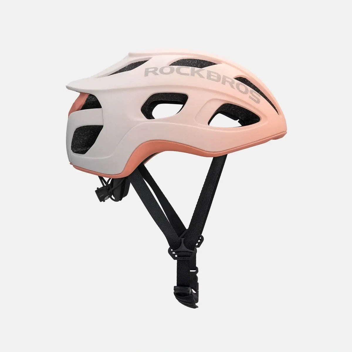 Lightweight bike helmet in matte pink, angled side view with ROCKBROS logo and straps