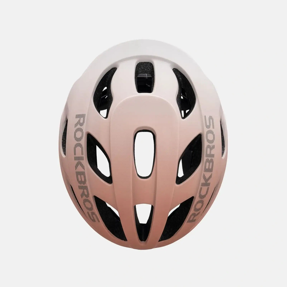 ROCKBROS bike helmet with light pink shell, black vents, and side branding