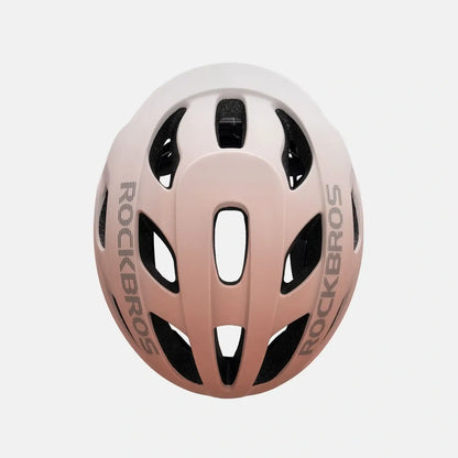 ROCKBROS bike helmet with light pink shell, black vents, and side branding