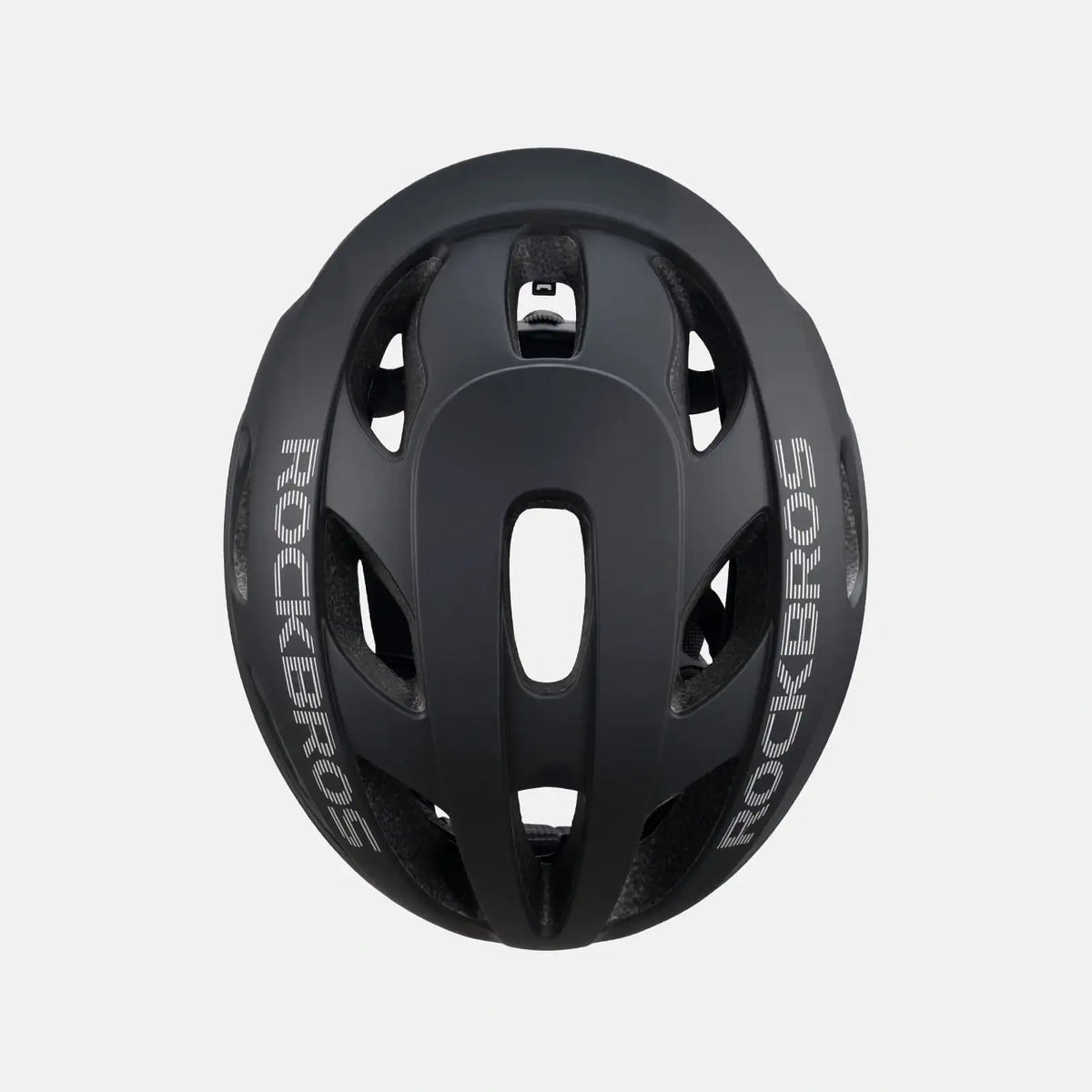 Lightweight bike helmet in matte black, close-up top with vent channels and central opening