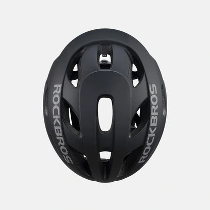 Lightweight bike helmet in matte black, close-up top with vent channels and central opening