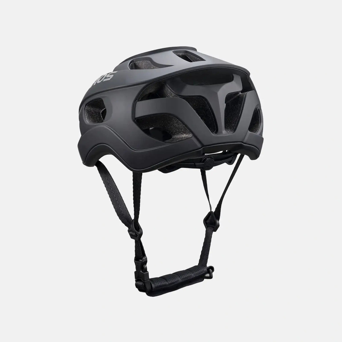 Lightweight bike helmet in matte black, front three-quarter view with vent openings and straps