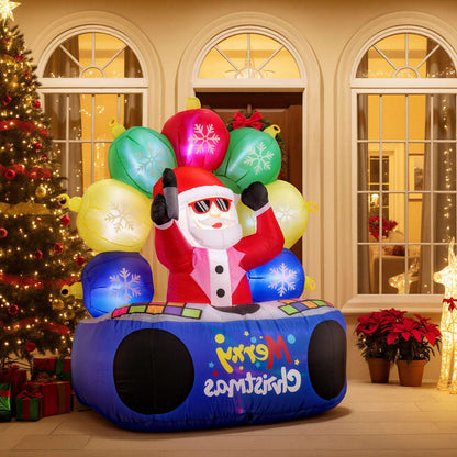Inflatable DJ Santa with raised arms, colorful light-up ornaments, and blue Merry Christmas base