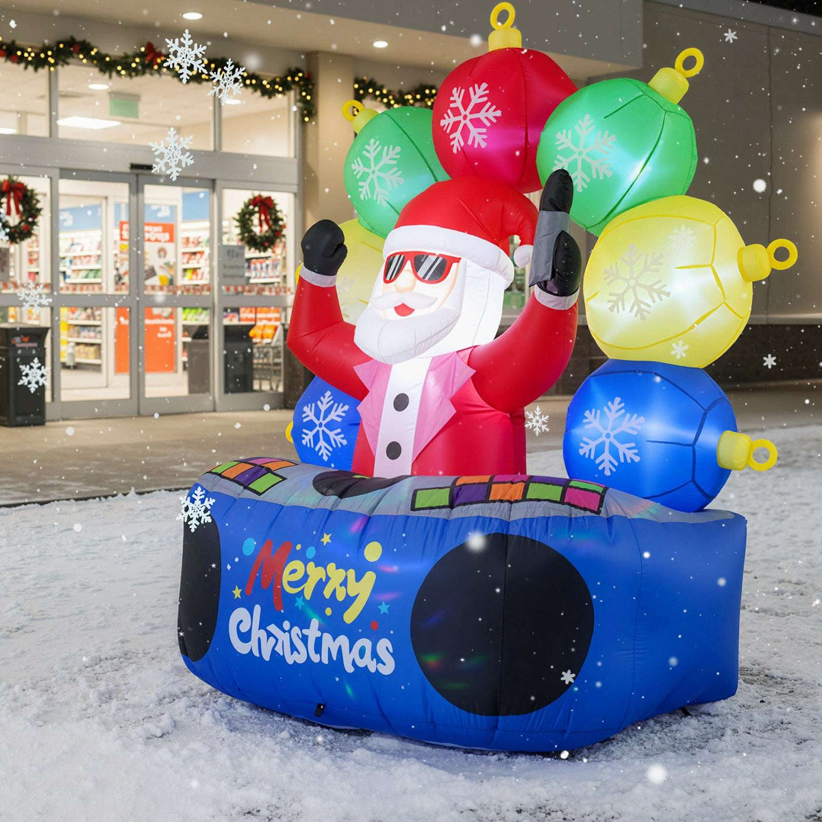 Inflatable DJ Santa with red suit, light-up ornaments, and blue Merry Christmas base